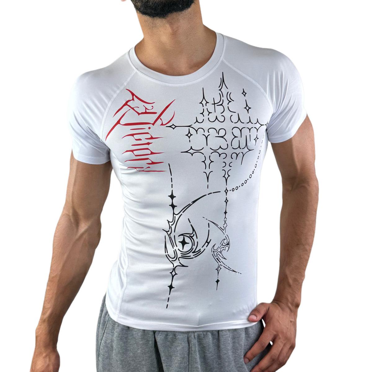 Male model in a white compression tee featuring abstract black and red designs across the chest.