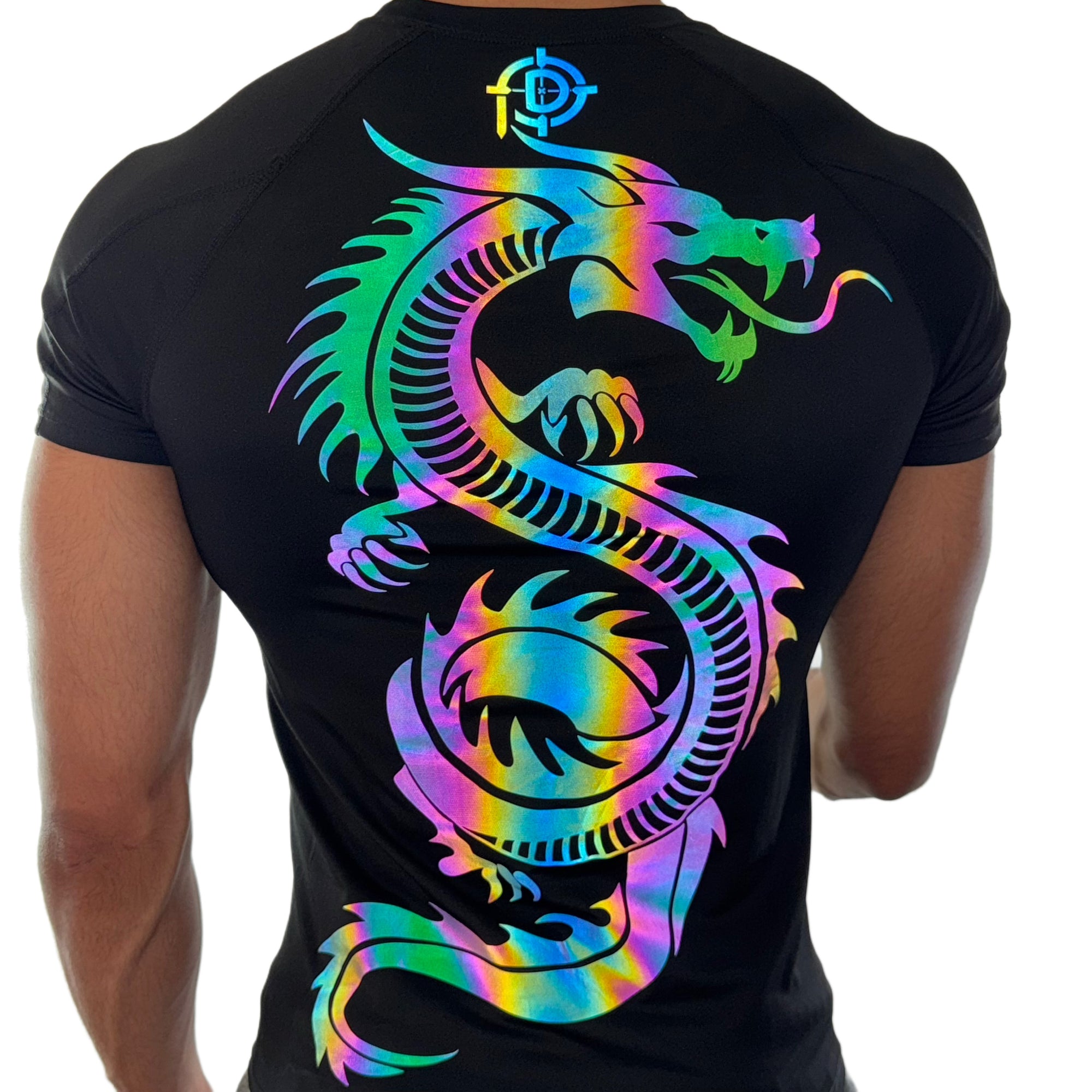 Back view of a men’s black compression shirt with a large reflective rainbow-colored dragon graphic, modeled on a white background