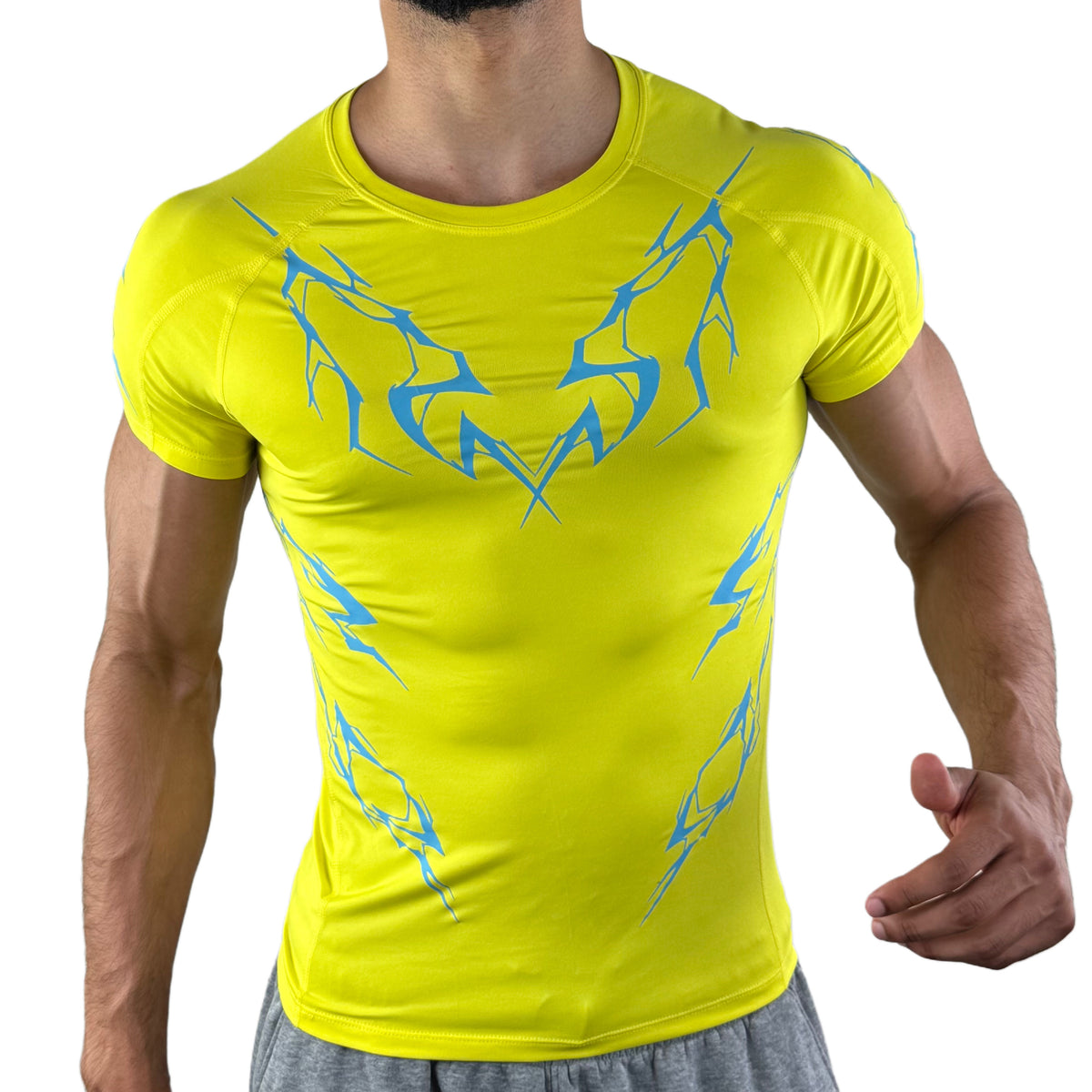Front view of a neon yellow athletic compression shirt featuring electric blue claw mark lightning patterns, modeled for fit and muscle contour.